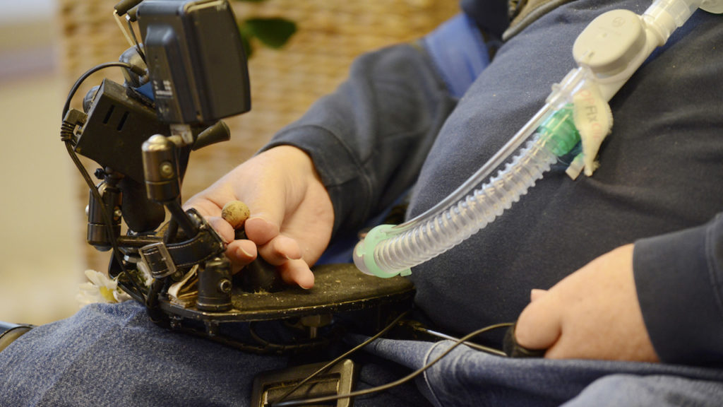 The fingertips control the wheelchair